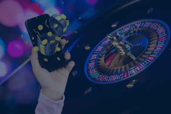 Hand holding a smartphone with coins and a gift box emerging, alongside a roulette wheel in the background, symbolizing online bonuses.