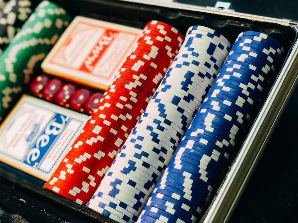 Various poker chips and poker cards.